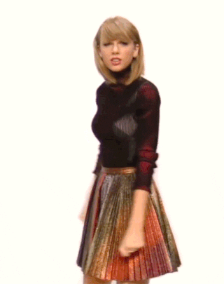 woman in skirt going "Boom!"